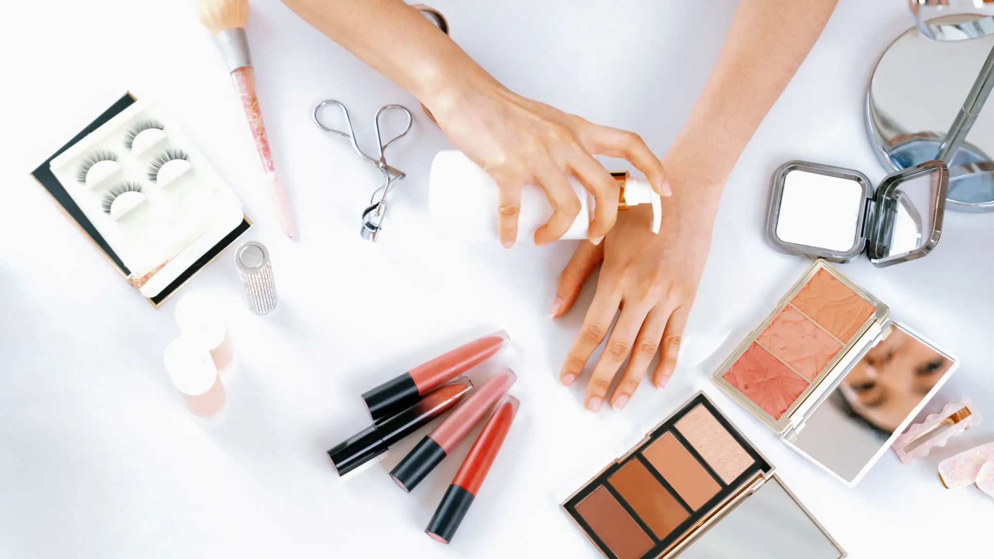 Beauty products and hands on table